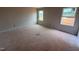 Unfinished bedroom with two windows providing natural light and views of the outdoors at 829 Ottawa Dr, Garner, NC 27529