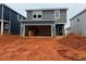 Two-story home showing the garage and gray siding at 829 Ottawa Dr, Garner, NC 27529