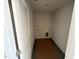 Narrow laundry room with hookups and a louvered door for ventilation at 829 Ottawa Dr, Garner, NC 27529
