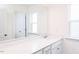 Clean bathroom with quartz countertops and abundant natural light at 925 Kinglet House Rd, Knightdale, NC 27545