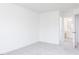 Bright bedroom features neutral carpeting and an connecting doorway to an ensuite bathroom at 925 Kinglet House Rd, Knightdale, NC 27545