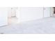 Bright bedroom features neutral carpeting and a connecting doorway to an ensuite bathroom at 925 Kinglet House Rd, Knightdale, NC 27545