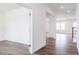 Open-concept entryway with new wood-look flooring and bright recessed lighting at 925 Kinglet House Rd, Knightdale, NC 27545