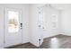 Light-filled entryway with French doors, and wood floors, leading to another room at 925 Kinglet House Rd, Knightdale, NC 27545