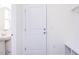 Well-lit entryway featuring a coat rack with bench, access door, and a half-bath at 925 Kinglet House Rd, Knightdale, NC 27545