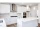 Stylish kitchen with island, stainless appliances, modern lighting, and white backsplash at 925 Kinglet House Rd, Knightdale, NC 27545