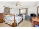 Bright bedroom with wood furniture and natural light at 9751 N Highway 96, Selma, NC 27576