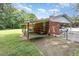 Cozy brick home featuring a covered carport and a well-maintained lawn at 9751 N Highway 96, Selma, NC 27576