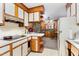 Functional kitchen with white cabinets, wood accents, and a view into the adjacent dining area at 9751 N Highway 96, Selma, NC 27576
