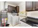 Laundry room featuring a washer, dryer, and ample storage space at 9751 N Highway 96, Selma, NC 27576