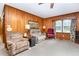 Spacious living room with wood paneling, comfortable seating, and vintage decor at 9751 N Highway 96, Selma, NC 27576