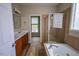 Bathroom with a tub, shower, and double sink vanity at 10 London Way, Spring Lake, NC 28390