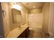 Bathroom featuring a single sink vanity and shower-tub combo at 10 London Way, Spring Lake, NC 28390