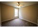 Neutral bedroom with plush carpet, ceiling fan, and bright window at 10 London Way, Spring Lake, NC 28390