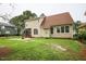 Exterior of the house and back yard with screened porch and privacy fence at 10 London Way, Spring Lake, NC 28390