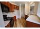 Open kitchen with stainless sink, wood cabinets, and modern countertops at 10 London Way, Spring Lake, NC 28390