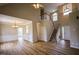 Open-concept living area with wood flooring, a staircase, and dining area, perfect for entertaining at 10 London Way, Spring Lake, NC 28390