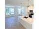 Modern kitchen showcasing white cabinetry, stainless steel appliances, and a center island at 1000 Regalia Rd # 1, Durham, NC 27713