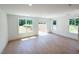 Spacious living room with hardwood floors, recessed lighting, and a sliding glass door to the outside at 1000 Regalia Rd # 1, Durham, NC 27713
