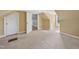This attic space features carpeted floors, a small window for natural light, and neutral paint at 102 W Weatherspoon St, Sanford, NC 27330