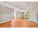 Finished attic space with orange painted floors, natural light, and access to the stairwell at 102 W Weatherspoon St, Sanford, NC 27330