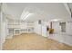 Basement features a laundry area, built-in shelves, and tile flooring, offering practicality and ample storage solutions at 102 W Weatherspoon St, Sanford, NC 27330