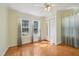 Sunny bedroom features wood floors and great natural light at 102 W Weatherspoon St, Sanford, NC 27330