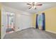 Bedroom with large closet and neutral carpet at 102 W Weatherspoon St, Sanford, NC 27330