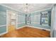 Classic dining room leads to kitchen, featuring hardwood floors at 102 W Weatherspoon St, Sanford, NC 27330