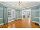 Cozy dining room boasts classic chandelier and natural light at 102 W Weatherspoon St, Sanford, NC 27330