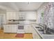 Functional kitchen with updated appliances and ample counter space at 102 W Weatherspoon St, Sanford, NC 27330