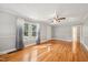 Sun-filled living room with hardwood floors and large, bright windows at 102 W Weatherspoon St, Sanford, NC 27330