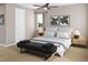 Cozy bedroom with neutral tones, ceiling fan, and decorative bench at 1037 Zelkova Ln, Chapel Hill, NC 27517