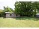 A well-maintained backyard with a detached garage and ample green space at 107 Rencher St, Hillsborough, NC 27278