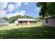 A sprawling backyard features a brick home with a white door at 107 Rencher St, Hillsborough, NC 27278