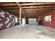The basement has painted walls and a concrete floor with open ceiling rafters at 107 Rencher St, Hillsborough, NC 27278