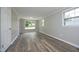 Sunlit bedroom with wood-look floors and fresh paint, ready for personalization at 107 Rencher St, Hillsborough, NC 27278