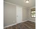 This bedroom showcases neutral paint and a door at 107 Rencher St, Hillsborough, NC 27278