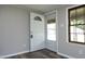 Bright entryway featuring new laminate floors, neutral paint, and natural light at 107 Rencher St, Hillsborough, NC 27278