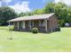 Charming brick home with a well-maintained front yard and inviting porch, creating a warm and welcoming curb appeal at 107 Rencher St, Hillsborough, NC 27278