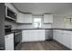 Modern kitchen featuring stainless steel appliances and stylish countertops and cabinets at 107 Rencher St, Hillsborough, NC 27278