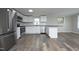 Modern kitchen featuring stainless steel appliances and stylish countertops with laminate floors at 107 Rencher St, Hillsborough, NC 27278