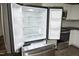 New stainless steel refrigerator with shelves is a highlight in the modern kitchen at 107 Rencher St, Hillsborough, NC 27278