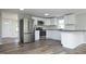 Modern kitchen featuring stainless steel appliances and stylish countertops and flooring at 107 Rencher St, Hillsborough, NC 27278