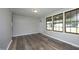 Cozy living room featuring laminate floors, neutral paint, and an abundance of natural light at 107 Rencher St, Hillsborough, NC 27278