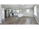 Bright open concept layout featuring a modern kitchen and living area with laminate floors at 107 Rencher St, Hillsborough, NC 27278