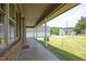 A covered porch with brick accents and a view of the surrounding neighborhood at 107 Rencher St, Hillsborough, NC 27278