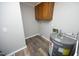 Compact utility room with essential appliances and storage at 107 Rencher St, Hillsborough, NC 27278