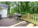 Outdoor deck area ideal for grilling and al fresco dining surrounded by a peaceful backyard at 110 Oak Park Dr, Benson, NC 27504