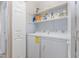 Well-equipped laundry area with modern washer and dryer, plus functional shelving for storage at 110 Oak Park Dr, Benson, NC 27504
